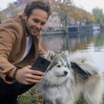 Daley Blind Taking A Picture By His OnePlus Phone With His Pet Dog